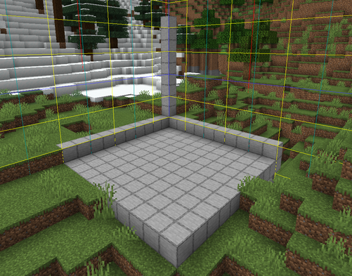An empty 10x10x10 area, with the axis marked with smooth stone.
